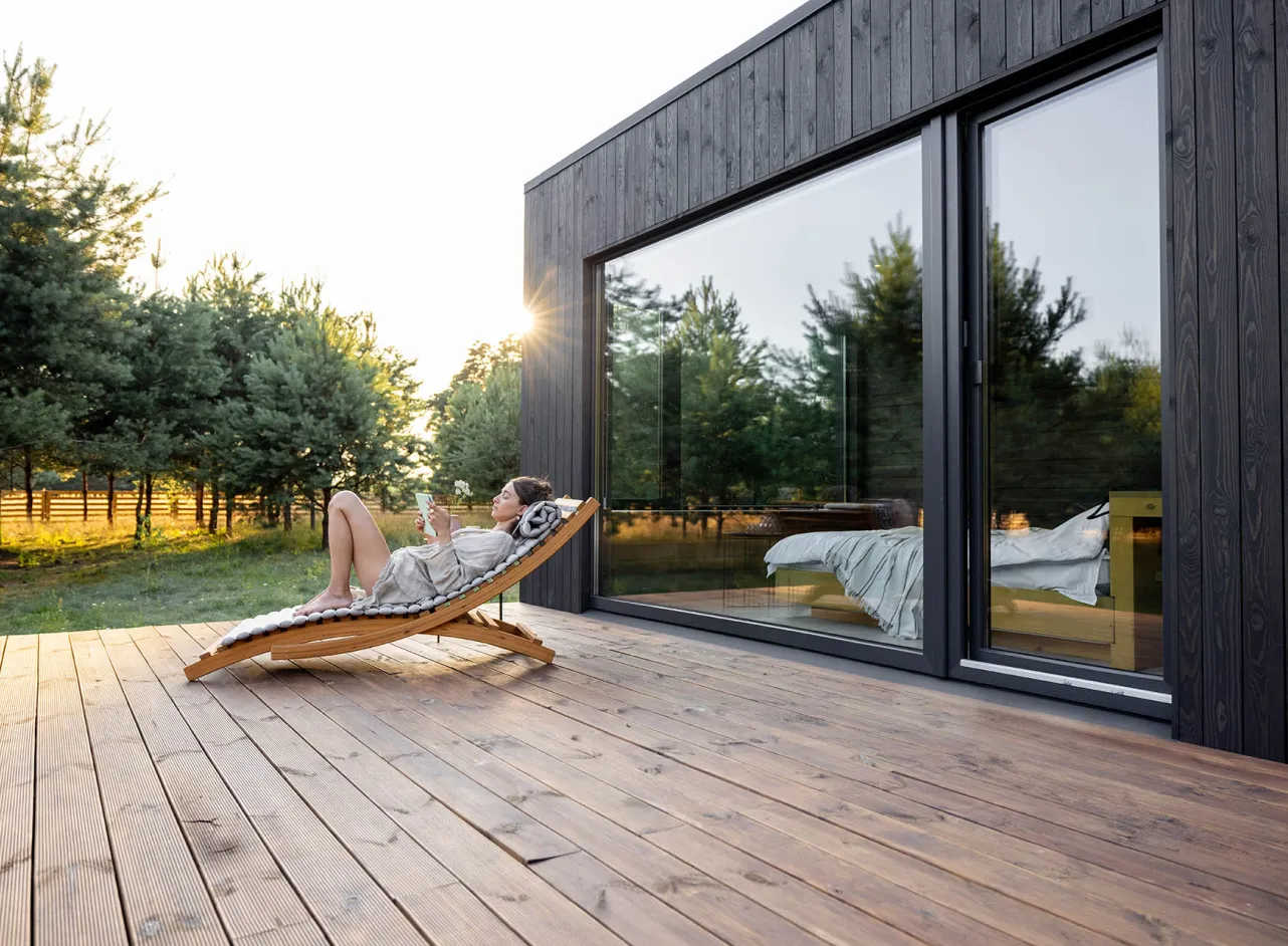 woman relaxing in terrace deckchair 
